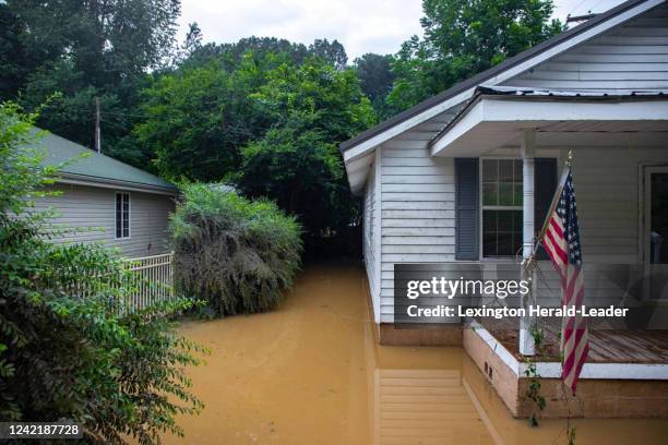 Receding flood waters surround a home in Whitesburg, Kentucky, on Friday, July 29, 2022.