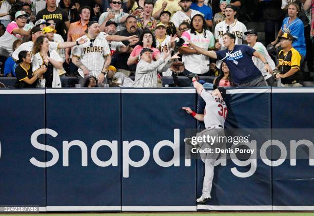 Kyle Garlick of the Minnesota Twins fails to make the catch on a home run hit by Manny Machado of the San Diego Padres during the fifth inning of a...