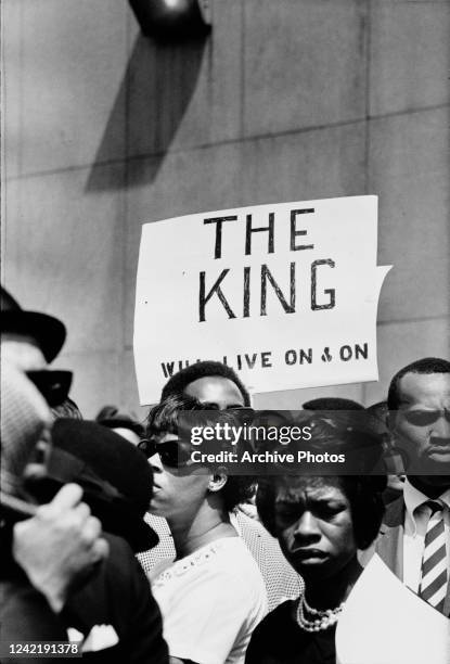 Sign reading 'The King Will Live On and On' at the funeral procession of assassinated civil rights leader Martin Luther King Jr in Atlanta, Georgia,...