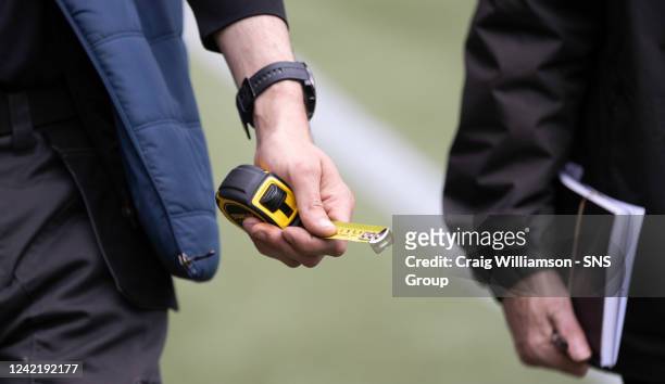 Match officials bring out a tape measure to measure the lines during a cinch Premiership match between Livingston and Rangers at Tony Macaroni Arena,...