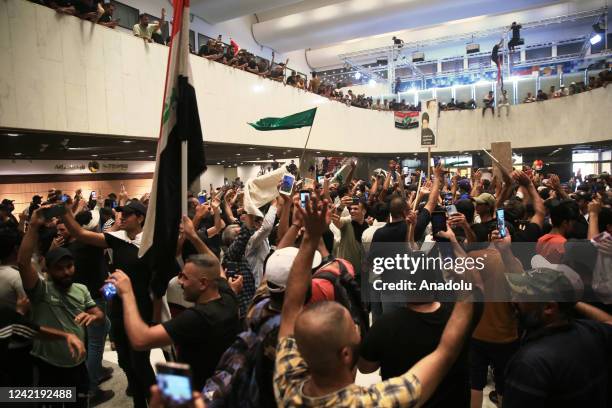 Supporters of Shiite cleric Moqtada al-Sadr storm the Iraqi parliament building in Baghdad's fortified Green Zone for the second time in a week as...