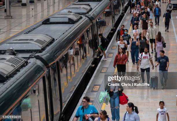 Passengers board a train at Paddington station during industrial strike action by ASLEF on July 30, 2022 in London, United Kingdom. ASLEF Union says...