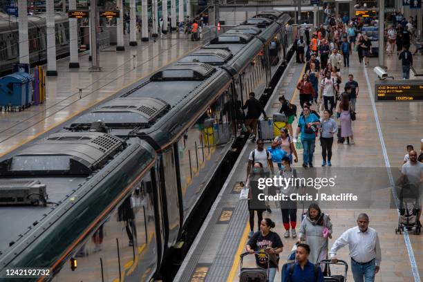 Passengers board a train at Paddington station during industrial strike action by ASLEF on July 30, 2022 in London, United Kingdom. ASLEF Union says...