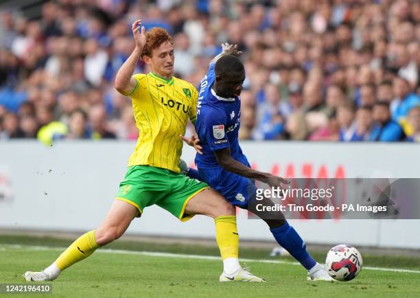 Cardiff City's Jamilu Collins and Norwich City's Josh Sargent battle for the ball during the Sky Bet Championship match at the Cardiff City Stadium....