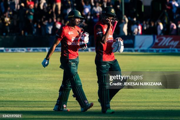 Banladesh captain Quazi Nurul Hasan Sohan and team mate Nasum Ahmed walk off the pitch after defeat during the first T20 cricket match played between...