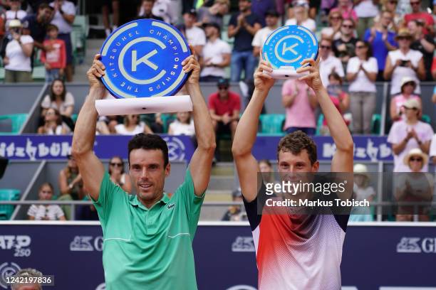 Roberto Bautista Agut of Spain and Filip Misolic of Austria celebrate with their trophies during the Austrian Open 2022 Day 8 at Tennisstadion...