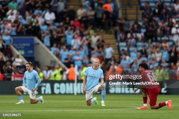 Jack Grealish and Erling Haaland of Manchester City take the knee ahead of kick-off during The Community Shield match between Manchester City and...