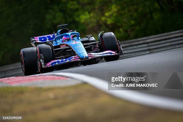 Alpine's Spanish driver Fernando Alonso competes during the qualifying session ahead of the Formula One Hungarian Grand Prix at the Hungaroring race...