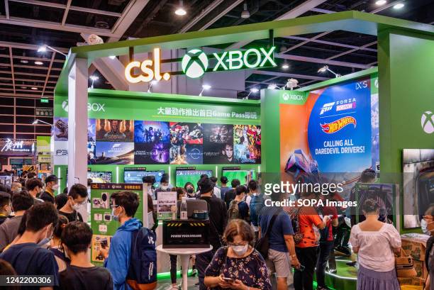 Visitors are seen at the booth from the American video gaming brand owned by Microsoft, Xbox, system during the Ani-com & Games ACGHK exhibition...