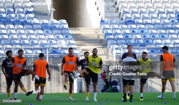 Ruben Neves of Wolverhampton Wanderers FC with teammates in action during the warm up before the start of the Pre-Season Friendly match between...