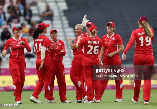 England's Izzy Wong celebrates taking the wicket of Sri Lanka's Nilakshi De Silva during the women's Twenty20 Cricket match between England and Sri...