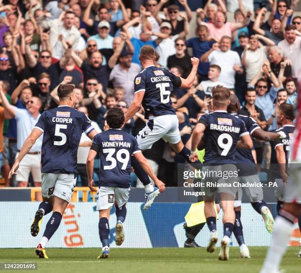 Milwalls Charlie Cresswell Leaps in celebration during the Sky Bet Championship match at the The Den, London. Picture date: Saturday July 30, 2022.