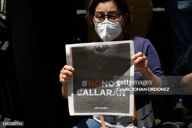 Guatemalan journalist protests against the arrest of Jose Ruben Zamora, president of the newspaper El Periodico, outside the Justice Palace in...