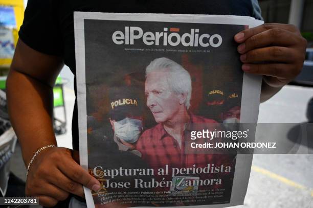 Guatemalan journalist protests against the arrest of Jose Ruben Zamora, president of the newspaper El Periodico, outside the Justice Palace in...