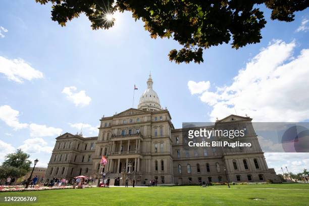 People attend a Rally The Vote event at the Michigan State Capitol on July 30, 2022 in Lansing, Michigan. The keynote speaker at the rally was...