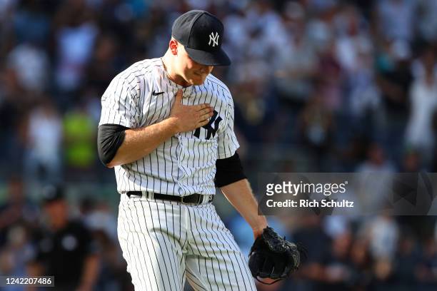 Clarke Schmidt of the New York Yankees reacts after getting the final out in the ninth inning of a game against the Kansas City Royals at Yankee...