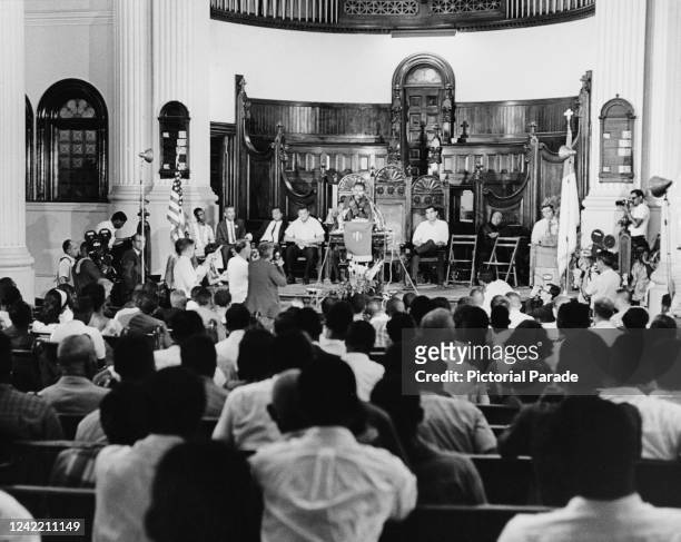 American civil rights leader Jesse Gray addresses a church meeting during the riots sparked by the killing of African American teenager James Powell...