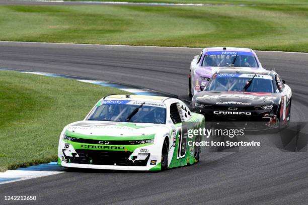 Allmendinger is challenged by Josh Berry and Ross Chastain DGM Racing Chevrolet Camaro SS in the NASCAR Xfinity Series Pennzoil 150 on July 30 at the...