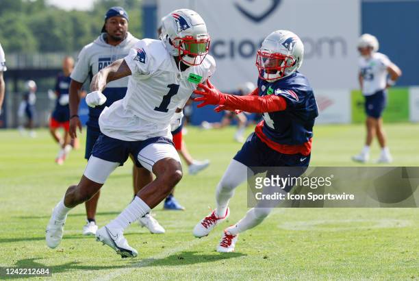 New England Patriots cornerback Malcom Butler tries to slow down wide receiver DeVante Parker during day 3 of New England Patriots training camp on...