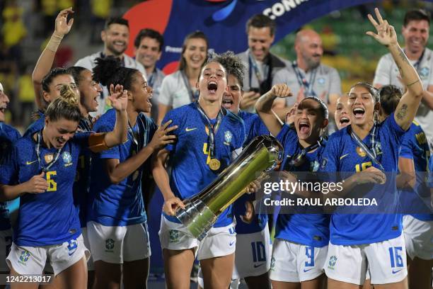 Brazil's players celebrate with the trophy after winning the Conmebol 2022 women's Copa America football tournament final match against Colombia at...