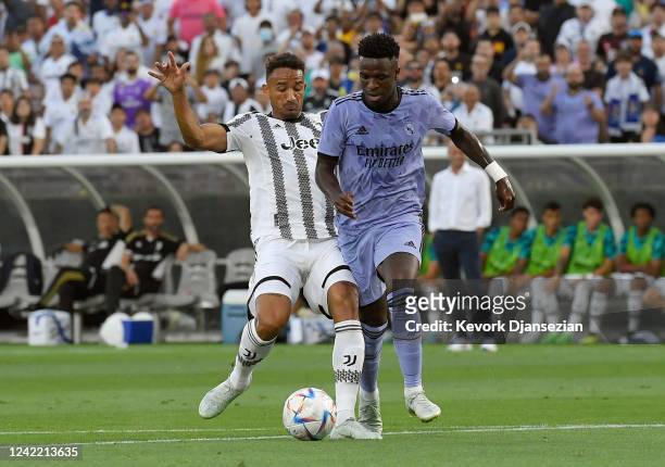 Vinícius Junior of Real Madrid is fouled by Danilo of Juventus during the first half of their friendly soccer match at the Rose Bowl on July 30, 2022...