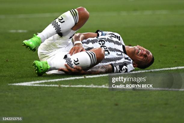 Juventus' Argentinian midfielder Angel Di Maria reacts in pain during the international friendly football match between Real Madrid and Juventus at...