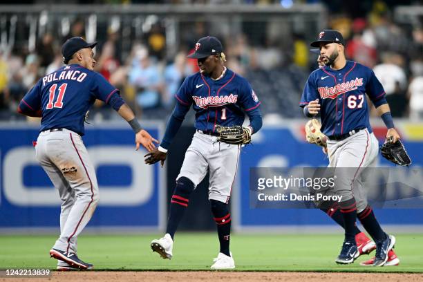 Minnesota Twins players high-five after beating the San Diego Padres 7-4 in a baseball game July 30, 2022 at Petco Park in San Diego, California.