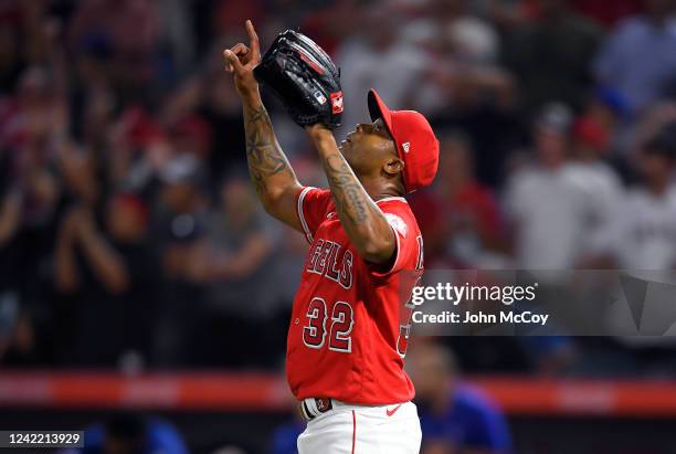 Raisel Iglesias of the Los Angeles Angels points to the sky after the final out in a victory over the Texas Rangers at Angel Stadium of Anaheim on...