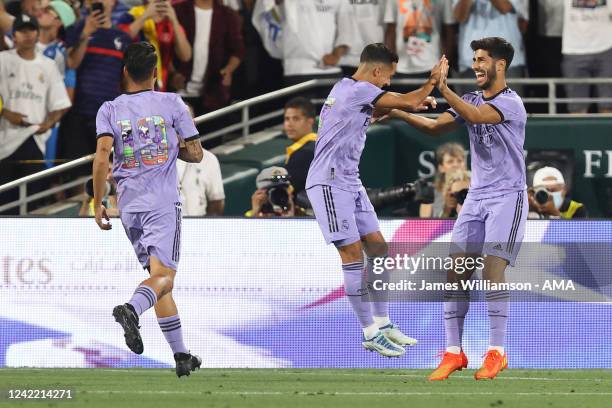 Marco Asensio of Real Madrid celebrates after scoring a goal to make it 2-0 during the pre season friendly between Real Madrid and Juventus at Rose...