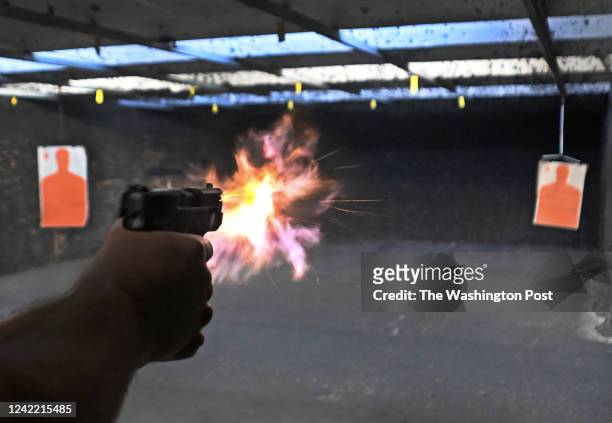 Skylar Honeycutt fires his Smith and Wesson 9mm pistol at a gun range in Ringgold, Georgia on July 15, 2022. Honeycutt has strong feelings about gun...