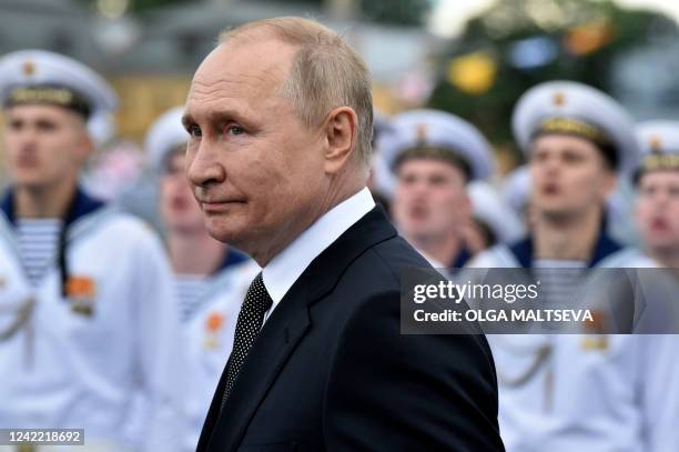 Russia's President Vladimir Putin reviews naval troops as he attends the main naval parade marking the Russian Navy Day, in St. Petersburg on July...