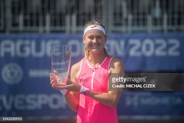 Czech Republic's Marie Bouzkova poses with the trophy after winning the Women's Single Final match against Russia's Anastasia Potapova at the Prague...
