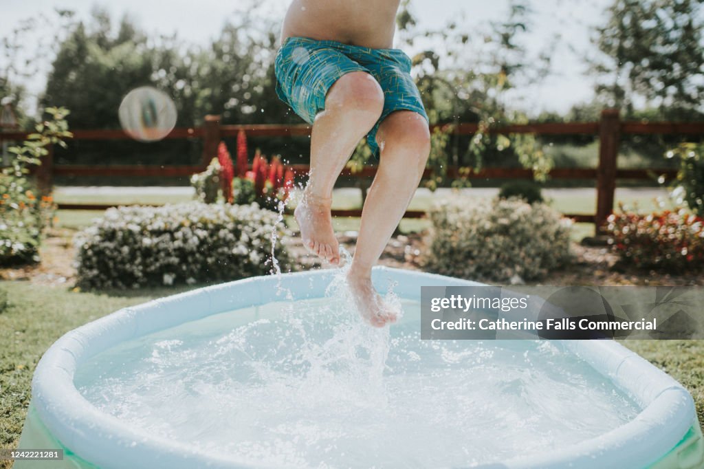 Boy in Paddling Pool
