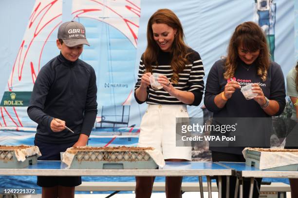 Catherine, Duchess Of Cambridge, takes parts in activities as she visits the 1851 Trust and the Great Britain SailGP Team at Trinity Pier on July 31,...
