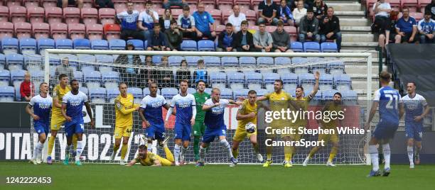 Preston North End's Liam Lindsay battles with Wigan Athletic's Jack Whatmough during the Sky Bet Championship between Wigan Athletic and Preston...