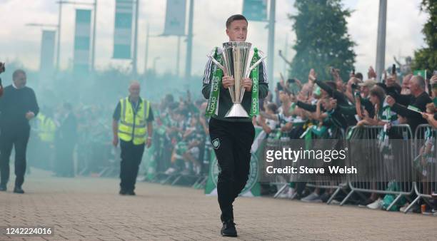 Celtics captain Callum McGregor arrives with the SPFL trophy before the Cinch Scottish Premiership match between Celtic FC and Aberdeen FC at Celtic...