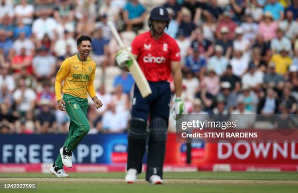 South Africa's Keshav Maharaj celebrates after the dismissal of England's Jos Buttler during the third T20 international cricket match between...