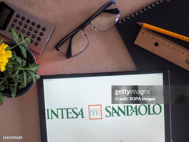 In this photo illustration, Intesa Sanpaolo S.p.A. Logo seen displayed on a tablet.