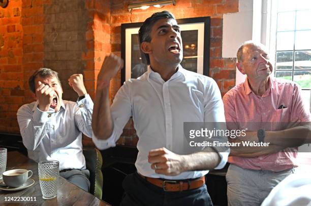 Conservative leadership hopeful Rishi Sunak and MP John Glen celebrate England's first goal as he watches the Women's Euro 2022 Final with fans at...