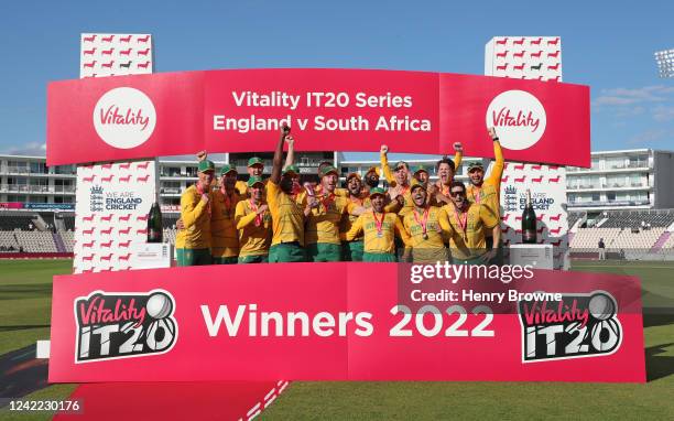 The South Africa team celebrate with the trophy after the 3rd Vitality IT20 match between England and South Africa at The Ageas Bowl on July 31, 2022...