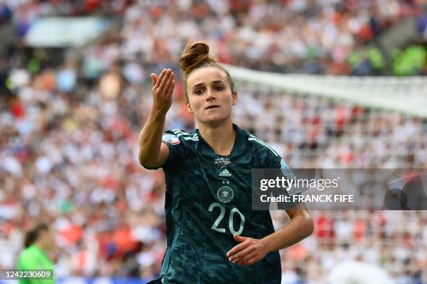 Germany's striker Lina Magull blows a kiss as she celebrates after scoring her team first goal during the UEFA Women's Euro 2022 final football match...