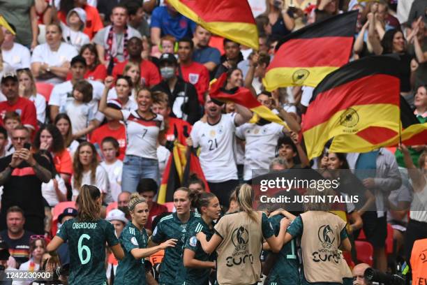 Germany's striker Lina Magull celebrates after scoring her team first goal during the UEFA Women's Euro 2022 final football match between England and...