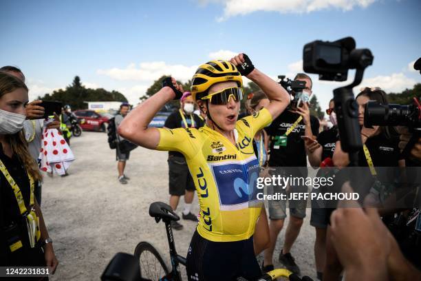 Movistar Team's Dutch rider Annemiek Van Vleuten wearing the overall leader's yellow jersey celebrates after winning the 8th and final stage of the...