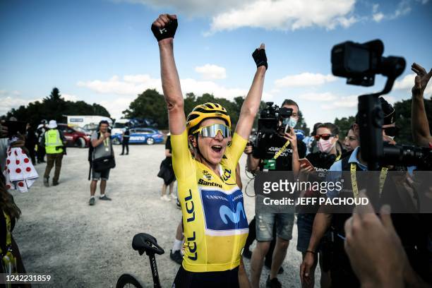 Movistar Team's Dutch rider Annemiek Van Vleuten wearing the overall leader's yellow jersey celebrates after winning the 8th and final stage of the...