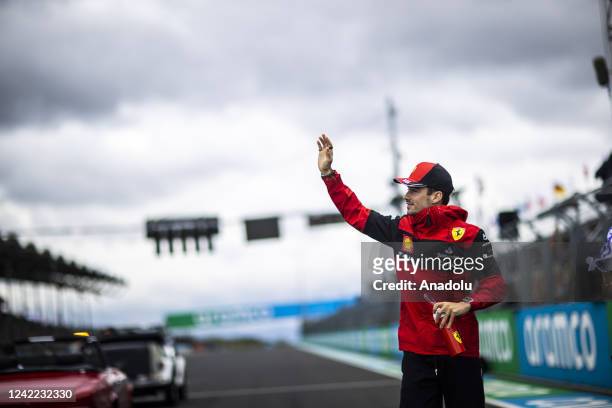 Charles Leclerc of Monaco and Ferrari waves to the crowd on the drivers parade ahead of the F1 Grand Prix of Hungary at Hungaroring on July 31, 2022...