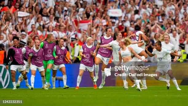 Chloe Kelly of England celebrates after scoring her team's second goal with teammates during the UEFA Women's Euro England 2022 final match between...