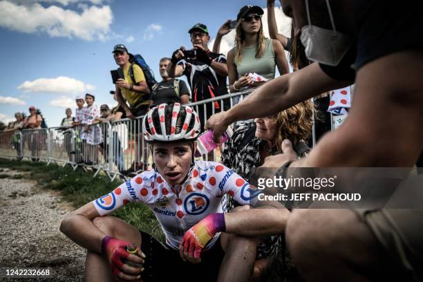 Team SD Worx's Dutch rider Demi Vollering wearing the climber's dotted jersey reacts after the 8th and final stage of the new edition of the Women's...
