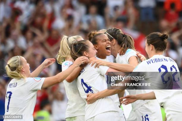 England's team players celebrate after winning at the end of the UEFA Women's Euro 2022 final football match between England and Germany at the...