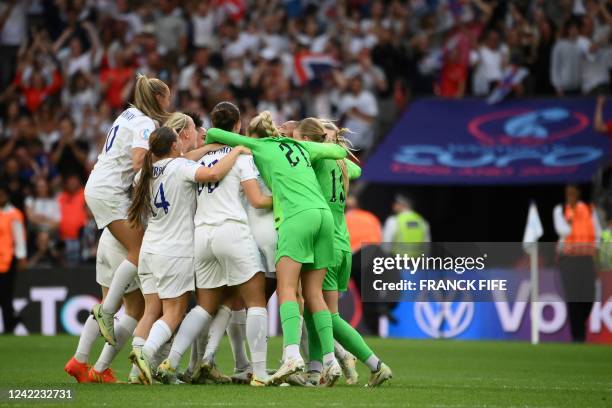 England's team players celebrate after winning at the end of the UEFA Women's Euro 2022 final football match between England and Germany at the...