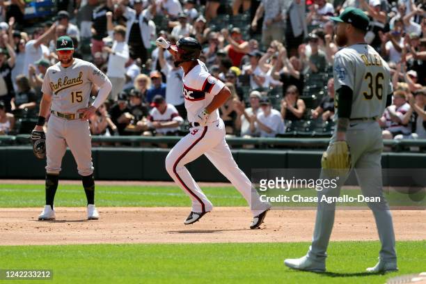 Jose Abreu of the Chicago White Sox celebrates as he runs the bases after hitting a home run against the Oakland Athletics in the second inning at...